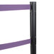 A black Aarco crowd control stanchion with purple tape on the poles.