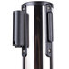 A chrome Aarco crowd control stanchion with two purple belts on metal cylinders.