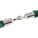 A green and silver Aarco stanchion rope with satin ends.