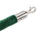 A green velvet stanchion rope with silver satin ends.