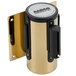 A gold and black metal Aarco wall mount cylinder.