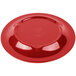 A red Carlisle melamine pie plate with a white background.