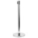 A chrome crowd control stanchion with a round metal base.