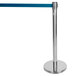 A silver Aarco crowd control stanchion pole with a blue retractable belt.