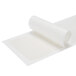A roll of white paper with plastic wrap on a white surface.