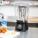 A Waring outer sound enclosure for a blender on a counter in a smoothie shop.