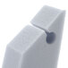 A white foam block with a hole.