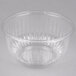 A Dart clear plastic bowl with a pointy pattern on the rim.