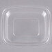 A Dart clear plastic dome lid on a rectangular plastic container.