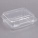 A Dart clear plastic container with a lid.