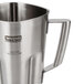 A Waring stainless steel blender jar with a handle.