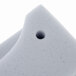A close up of a white foam baffle with a hole in it.
