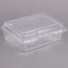 A Dart clear plastic oblong container with a lid.