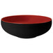 A white melamine bowl with a black and red design.