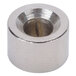 A round silver metal spacer with a hole in it.