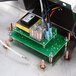 A Nemco Fresh-O-Matic countertop rethermalizer retrofit kit with a green circuit board and wires.