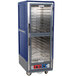 A blue and silver Metro C5 holding and proofing cabinet with clear Dutch doors.