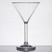 A clear plastic martini glass with a long stem.