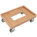 A beige plastic Cambro Camdolly with black wheels.