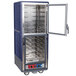 A blue and silver Metro C5 holding and proofing cabinet with clear Dutch doors open.