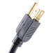 A close up of a black and gold power cord with a plug.