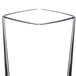 A close up of a clear plastic Thunder Group square shooter/dessert shot glass.