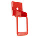 A red plastic Cecilware push handle with a hole.