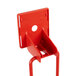 A red plastic Cecilware push handle holder with a hole.
