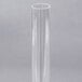 A clear plastic tube with a long stem.