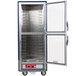 A blue Metro C5 hot holding cabinet with clear Dutch doors open.