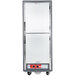 A gray Metro C5 hot holding cabinet with two solid doors and wheels.