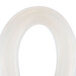 A white small silicone tube with a hole in it.