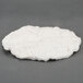 A round white cotton insulation pad.
