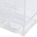A clear plastic box with a clear plastic lid and a white handle containing a white Cal-Mil infusion chamber.