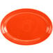 An orange oval Fiesta china platter on a white background.