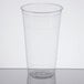 A Solo Ultra Clear plastic cup with a clear lid on a table.