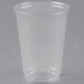 A Solo Ultra Clear plastic cup on a gray surface.