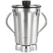 A silver Waring blender container with handles and a stainless steel lid.