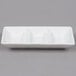 A white rectangular porcelain dish with three compartments.