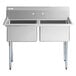 A Regency stainless steel two compartment sink with galvanized steel legs.