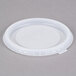 A translucent plastic lid with a white lid on top.