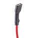 A red and black electrical lead with a red connector.