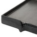 A black metal griddle with a square edge.