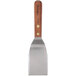 A Dexter-Russell metal spatula with a wood handle.
