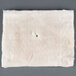A white square piece of paper with a hole in it.
