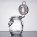 An American Metalcraft miniature glass apothecary jar with a metal lid and ring.