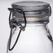 An American Metalcraft glass miniature apothecary jar with a metal hinge and ring.