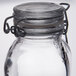 An American Metalcraft miniature glass apothecary jar with a metal lid.