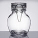 An American Metalcraft miniature glass jar with a metal hinge.