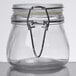 An American Metalcraft miniature glass apothecary jar with a metal clip.